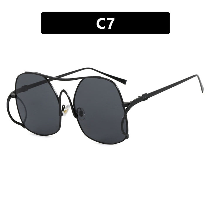 Dame geometrisk solbrille med smal metallramme og brune glass Skanto