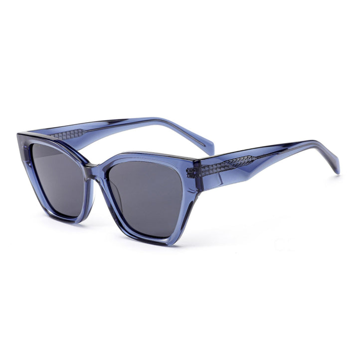 Dame solbrille med moderne ramme og lekne detaljer Skanto