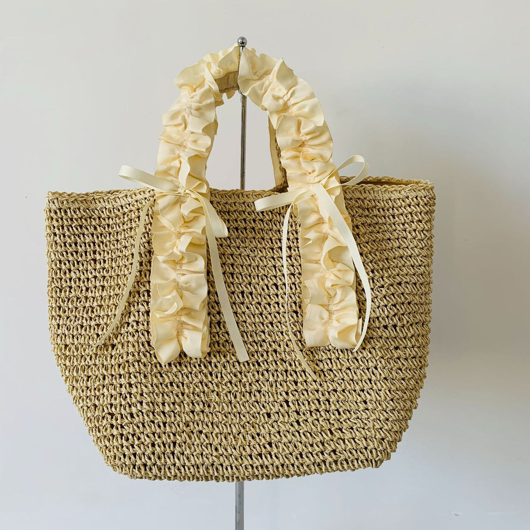 Heklet strandveske med elegante satinfinesser Skanto