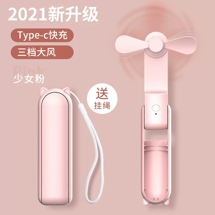 Unisex en størrelse sammenleggbar oppladbar trippel håndholdt mini vifte med innebygd powerbank USB-C og USB-A tilkoblinger samt håndleddsstropp Skanto