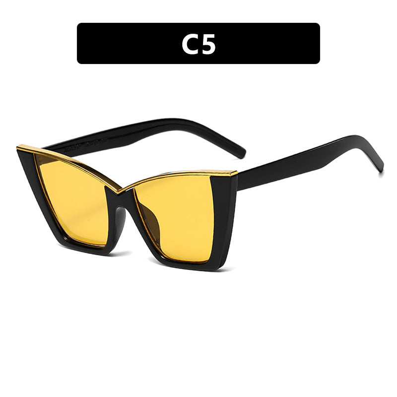 Dame ekstravagant solbrille med unik design og gullige aksenter Skanto