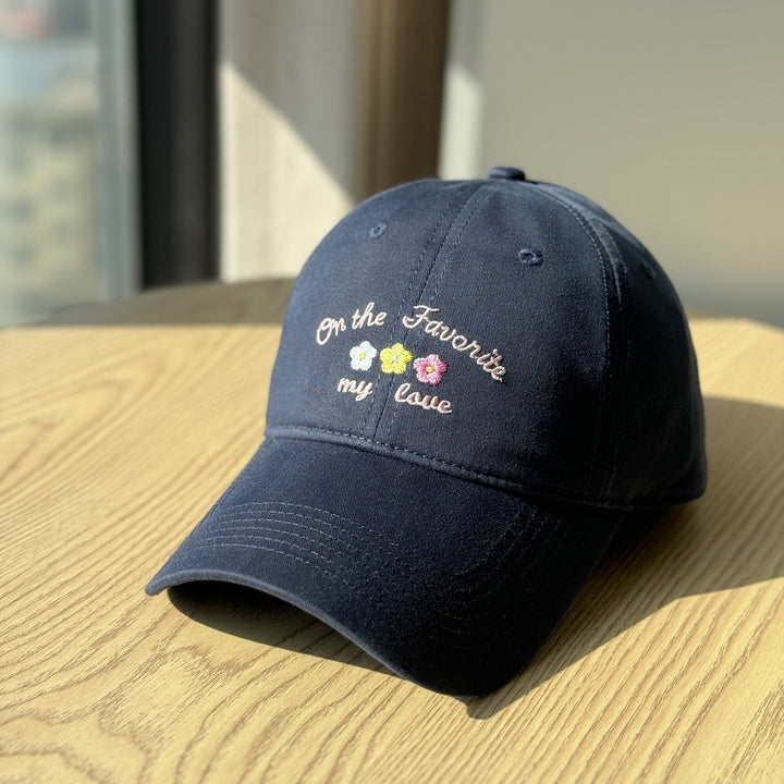Kvinners broderte tekstlue Skanto