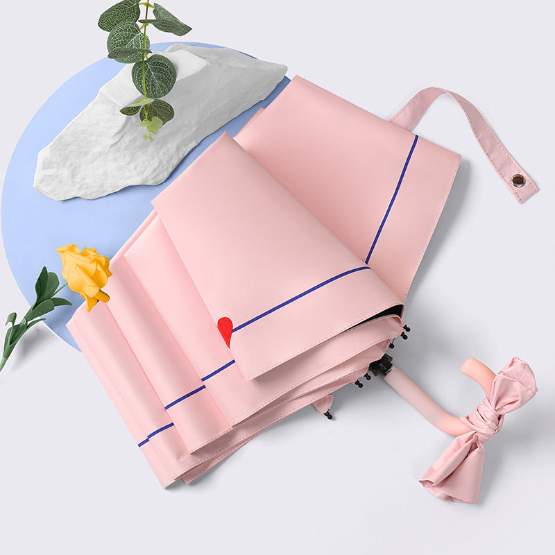 Dame sammenleggbart paraply med elegant hjerte-design Skanto