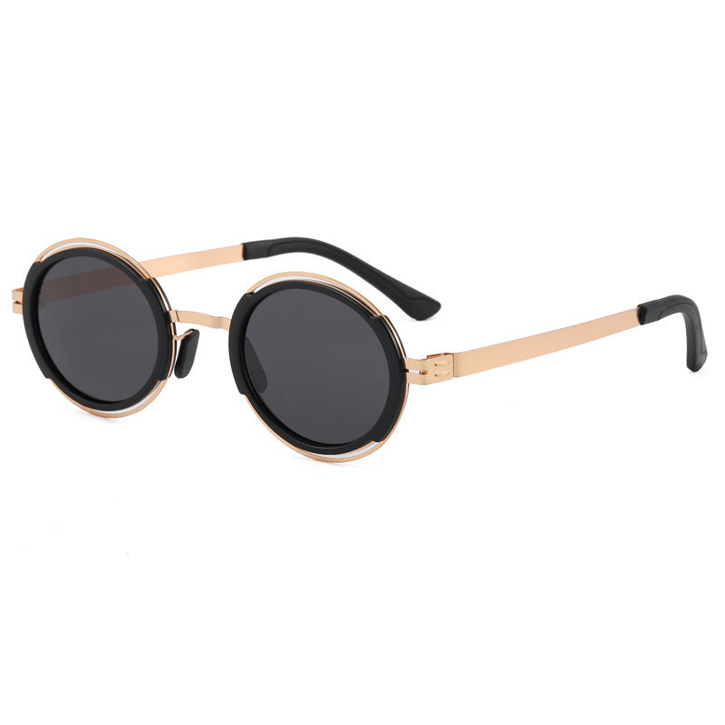 Damer moteriktig rund solbrille med elegant metallramme Skanto
