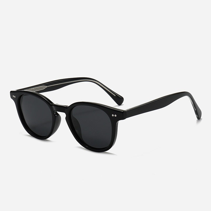 Dame Rund solbrille med stilfullt mønster og UV-beskyttelse Skanto