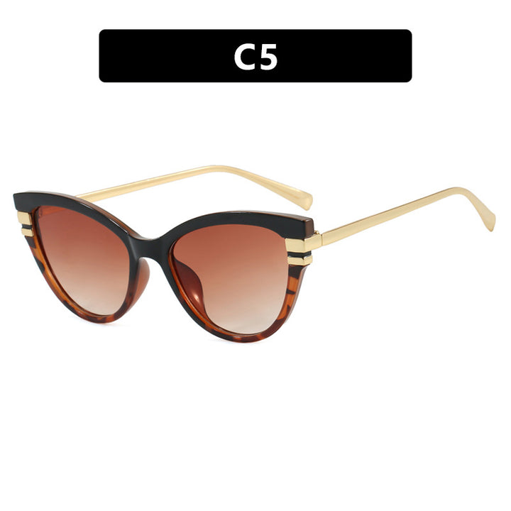 Dame Cat-Eye solbriller med elegant plastramme og gullaccentuer Skanto