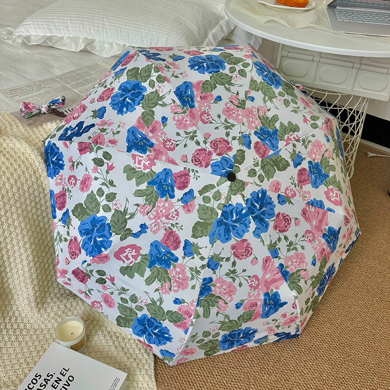 Dame folde paraply med høykvalitets blomsterdesign Skanto