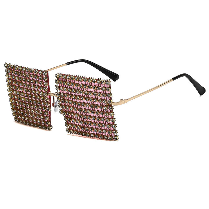 Dame solbrille med glitrende krystallramme og iøynefallende strukturdesign Skanto
