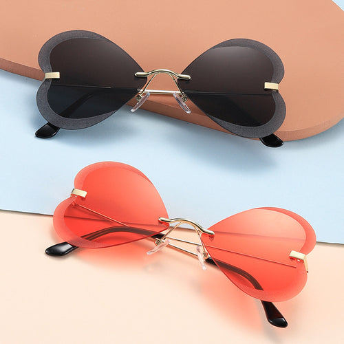 Kvinnelige hjerteformede solbriller i trendy design Skanto