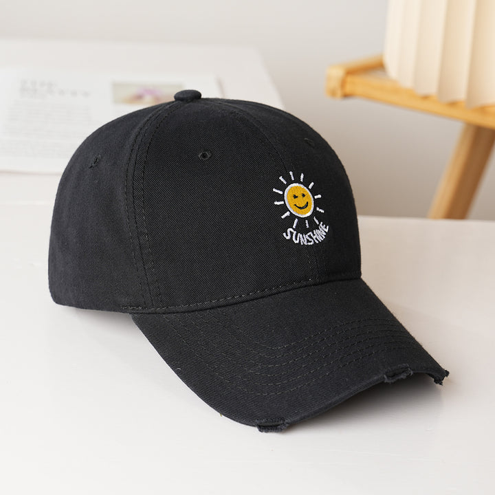 Dame sporty bomullslue med solbroderi Skanto