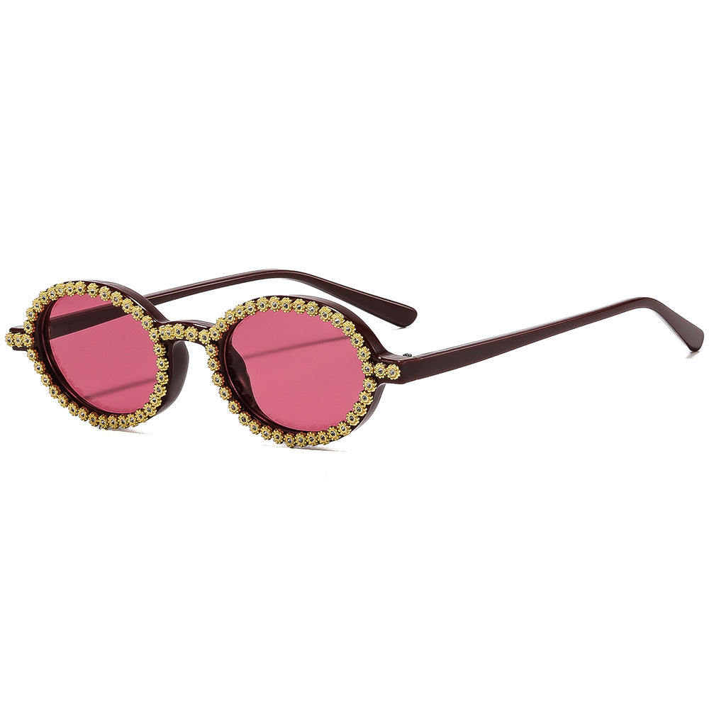 Damer moteriktig solbrille med blomstrete krystallramme Skanto