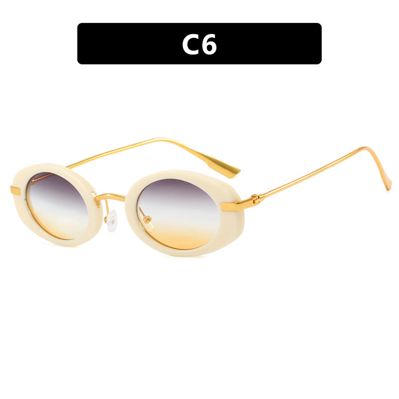 Dame moteriktig solbrille i elegant ovalt design Skanto