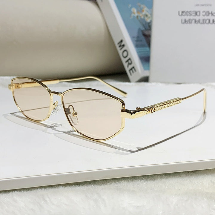 Dame elegant solbrille med glitrende metallramme Skanto