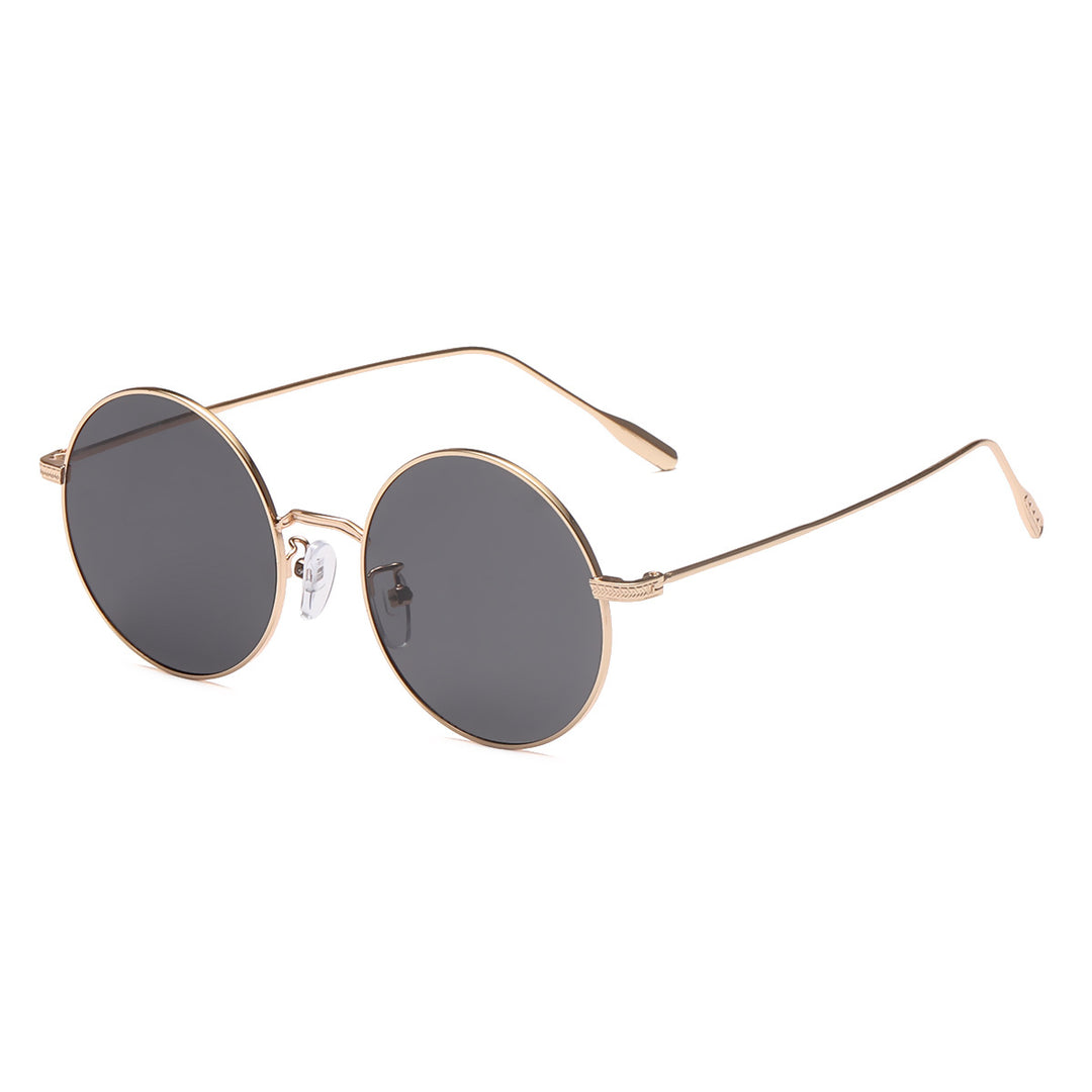 Dame rund solbrille med elegant metallramme og polarisert glass Skanto