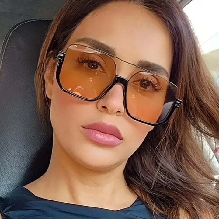 Dame kvadratisk solbrille med gjennomsiktig ramme og grønntonet glass Skanto