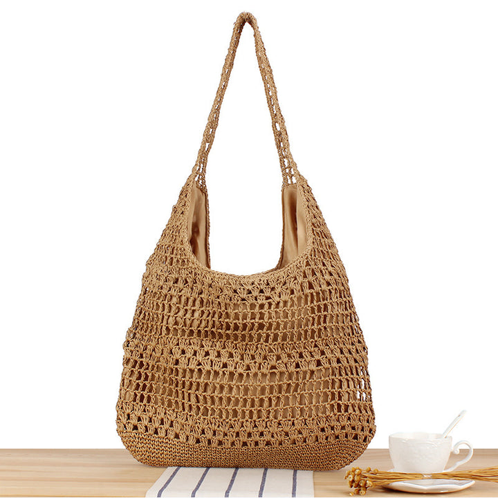 Handbag with floral appliqué in natural material Skanto