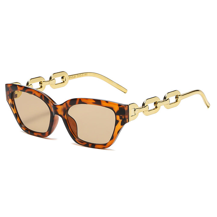 Dame Cat-Eye solbrille med dekorativ kjettingramme Skanto