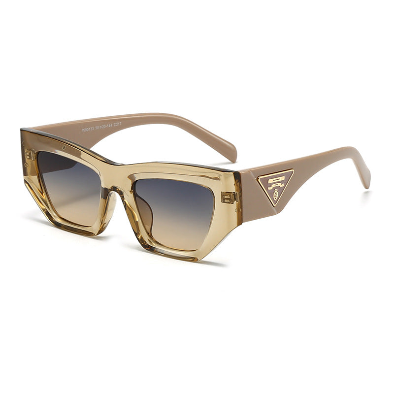 Dame Designer solbrille med moderne, geometrisk ramme Skanto