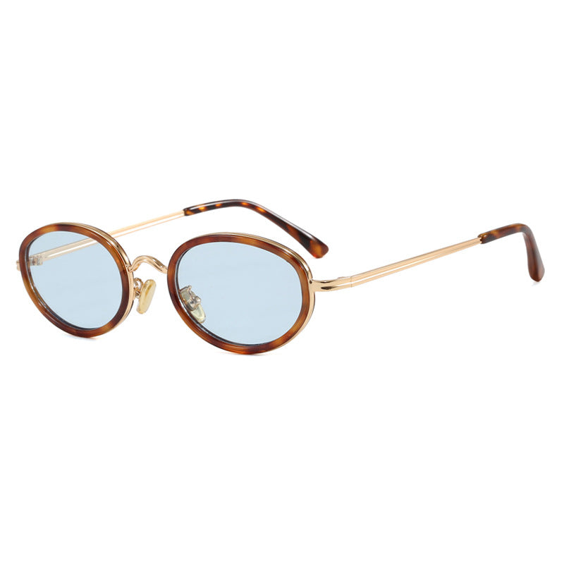 Dame elegant rund solbrille med moderne metallramme Skanto