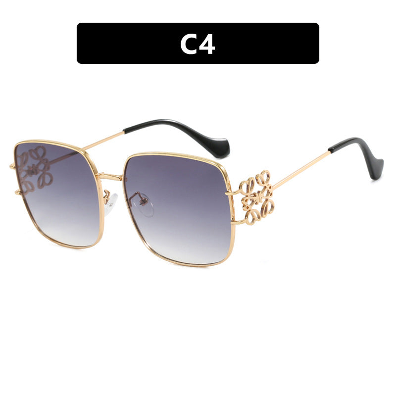 Dame kvadratisk solbrille med filigran design og luksuriøs metallramme Skanto