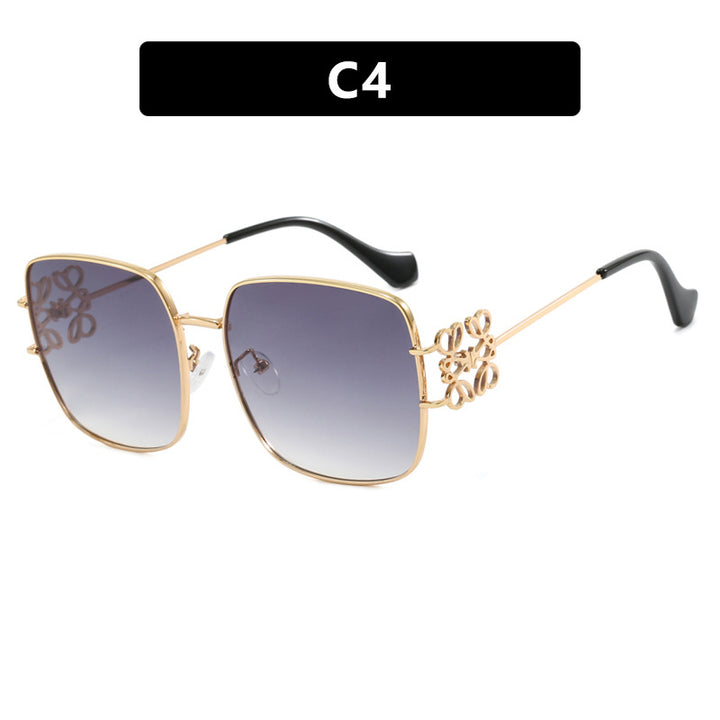 Dame kvadratisk solbrille med filigran design og luksuriøs metallramme Skanto