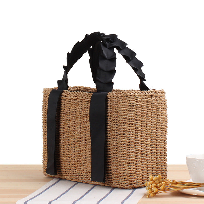 Playful basket bag with elegant fabric handle Skanto