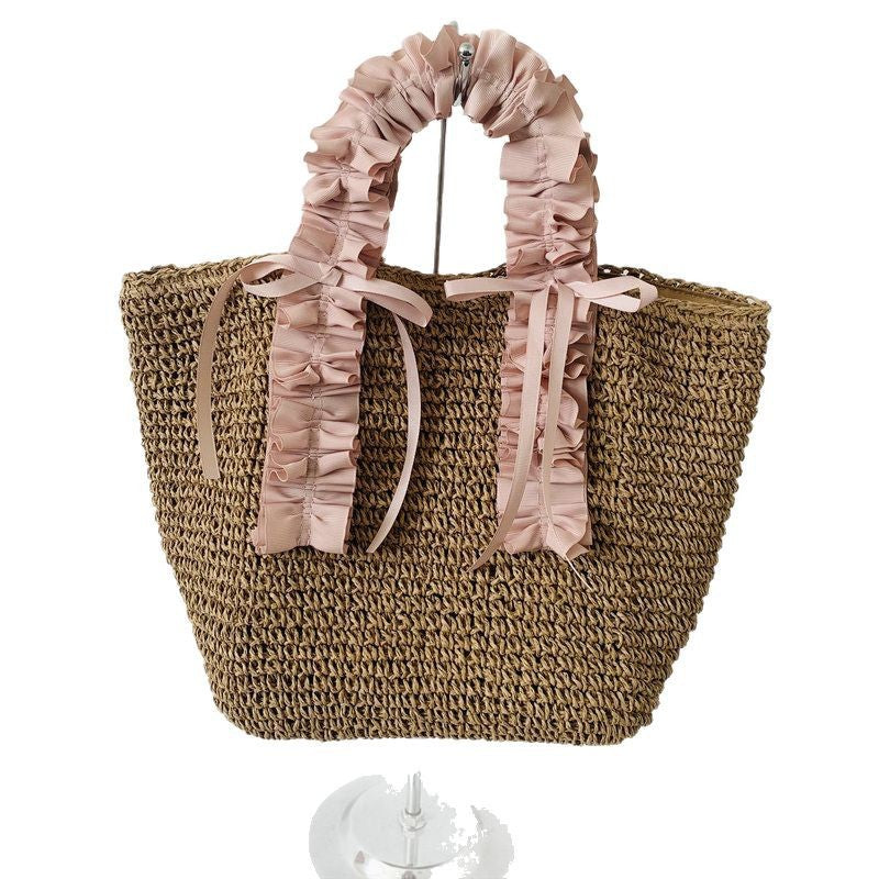 Heklet strandveske med elegante satinfinesser Skanto