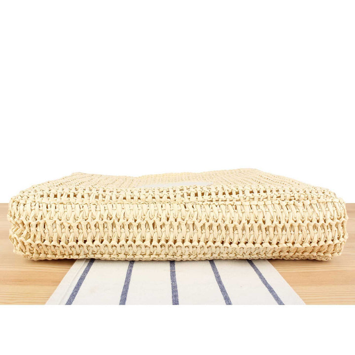 Håndveske laget av naturlig flette med minimalistiske detaljer Skanto