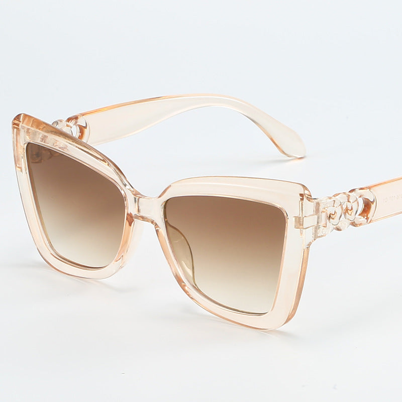 Dame moderne Cat-Eye solbriller med klar ramme og UV-beskyttelse Skanto