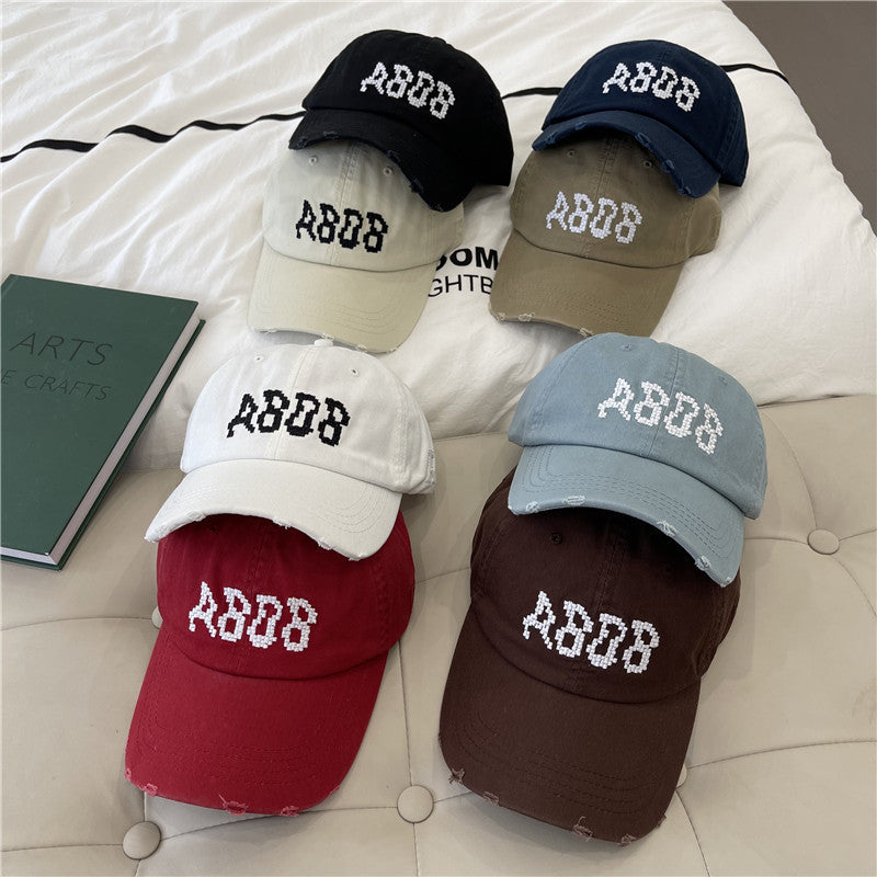 Kvinnens slitte bomull baseballcaps med grafisk detaljer Skanto