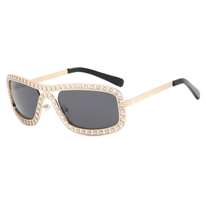 Dame moteriktig solbrille med glitrende ramme Skanto