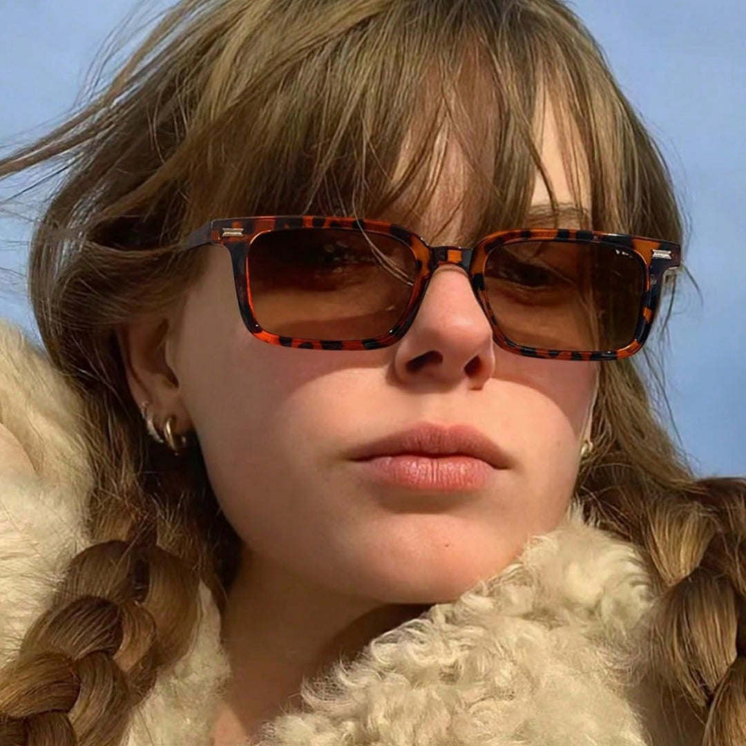 Dame elegant solbrille med transparent ramme Skanto