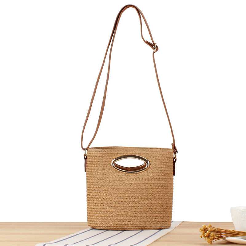 Handwoven natural material crossbody bag with elegant ring clasp Skanto