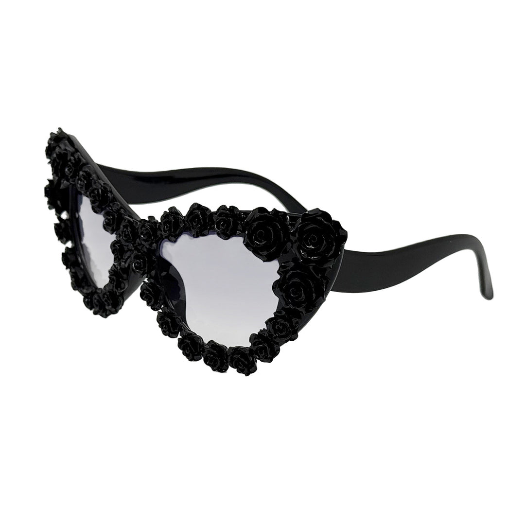 Damen hjerteformet solbrille med blomsterapplikasjon Skanto