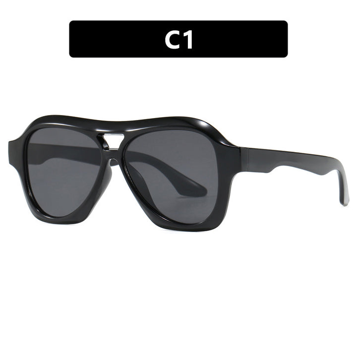 Dame moterik solbrille i innovativ design med bred ramme Skanto