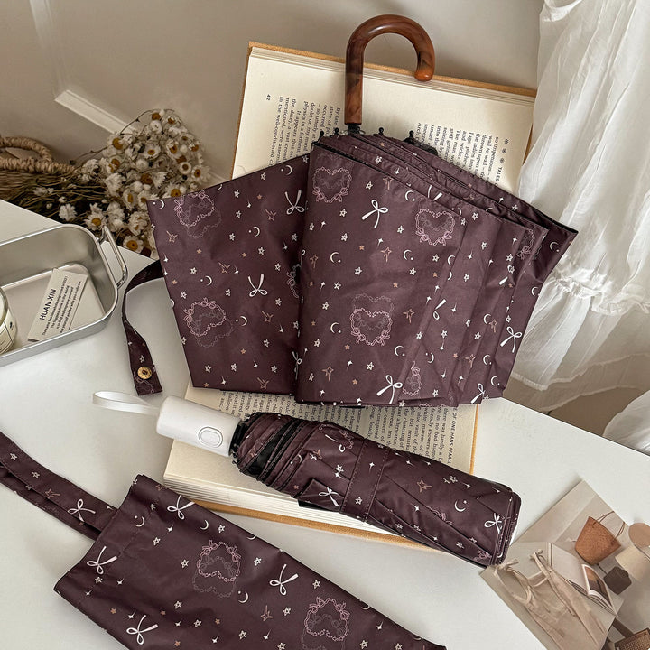 Dame sammenleggbart regnparaply med elegant anhengdesign Skanto