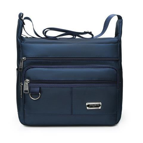 Praktisk crossbody-veske med multifunksjonelt fagssystem Skanto