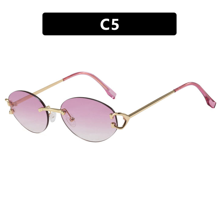 Dame elegant ovalformet solbrille med moderne metalramme Skanto