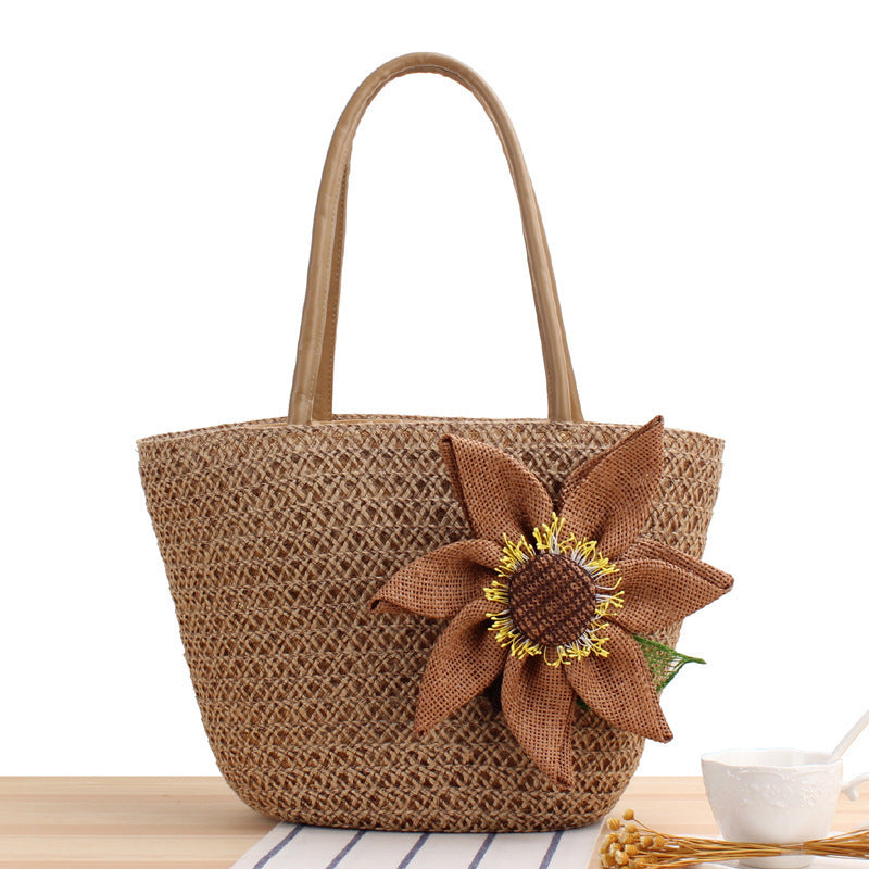 Handbag with floral appliqué in natural material Skanto