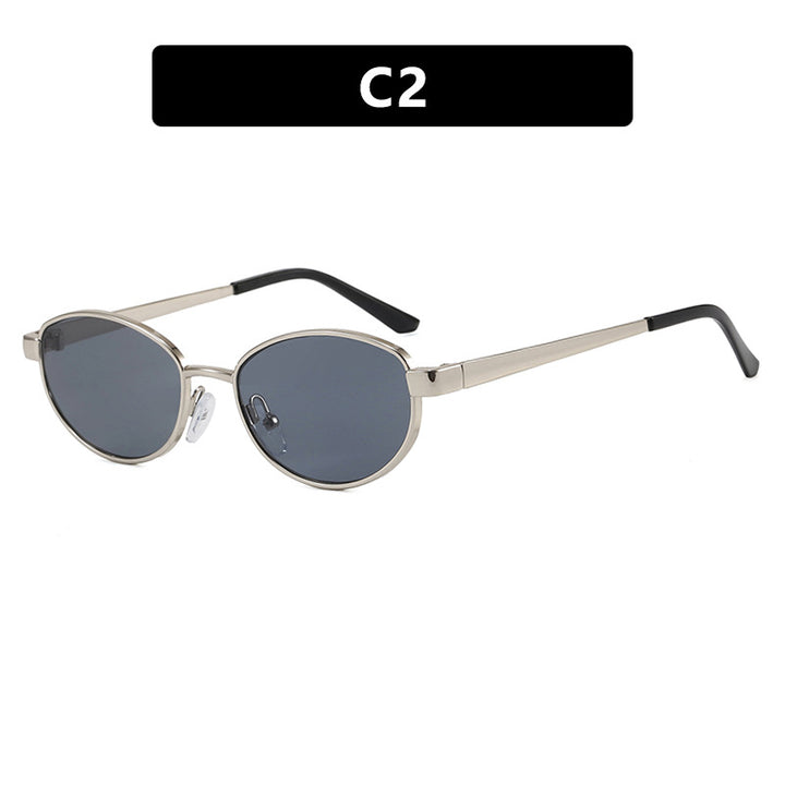 Dame moteriktig solbrille i elegant oval design med ramme i høykvalitets metall Skanto