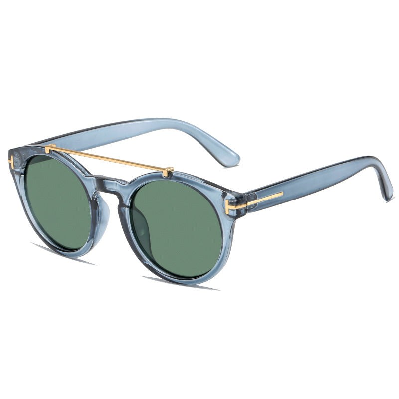 Dame fashionable solbriller med elegante runde glass Skanto
