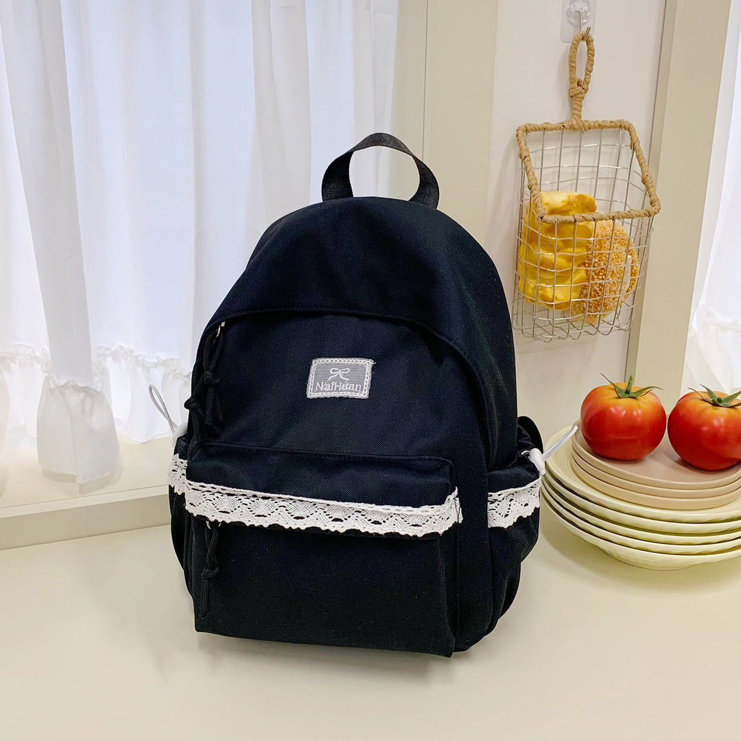 Elegant skolesekk med lacedetaljer