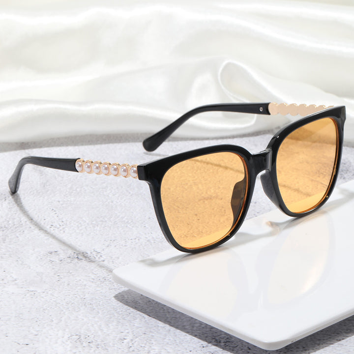Damer oversized solbriller med elegant perlepynt-dekorasjon Skanto