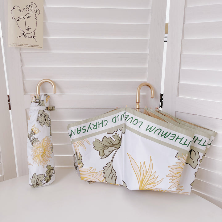 Dame elegant sammenleggbar paraply med hjerteformet design Skanto