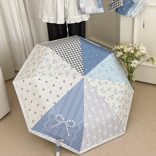 Damer paraply i romantisk patchwork-design Skanto