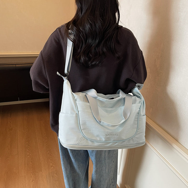 Damer Sporty Reiseduffel med romslig innvendig rom og justerbar skulderreim Skanto