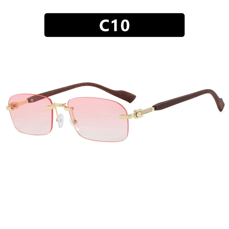 Dame solbrille med elegant metallramme og stilige tre detaljer Skanto