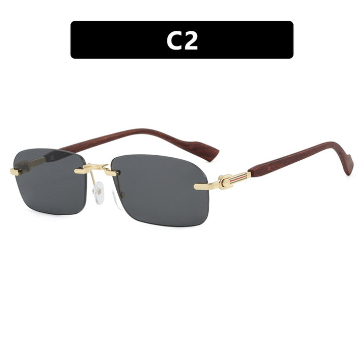 Dame solbrille med elegant metallramme og stilige tre detaljer Skanto