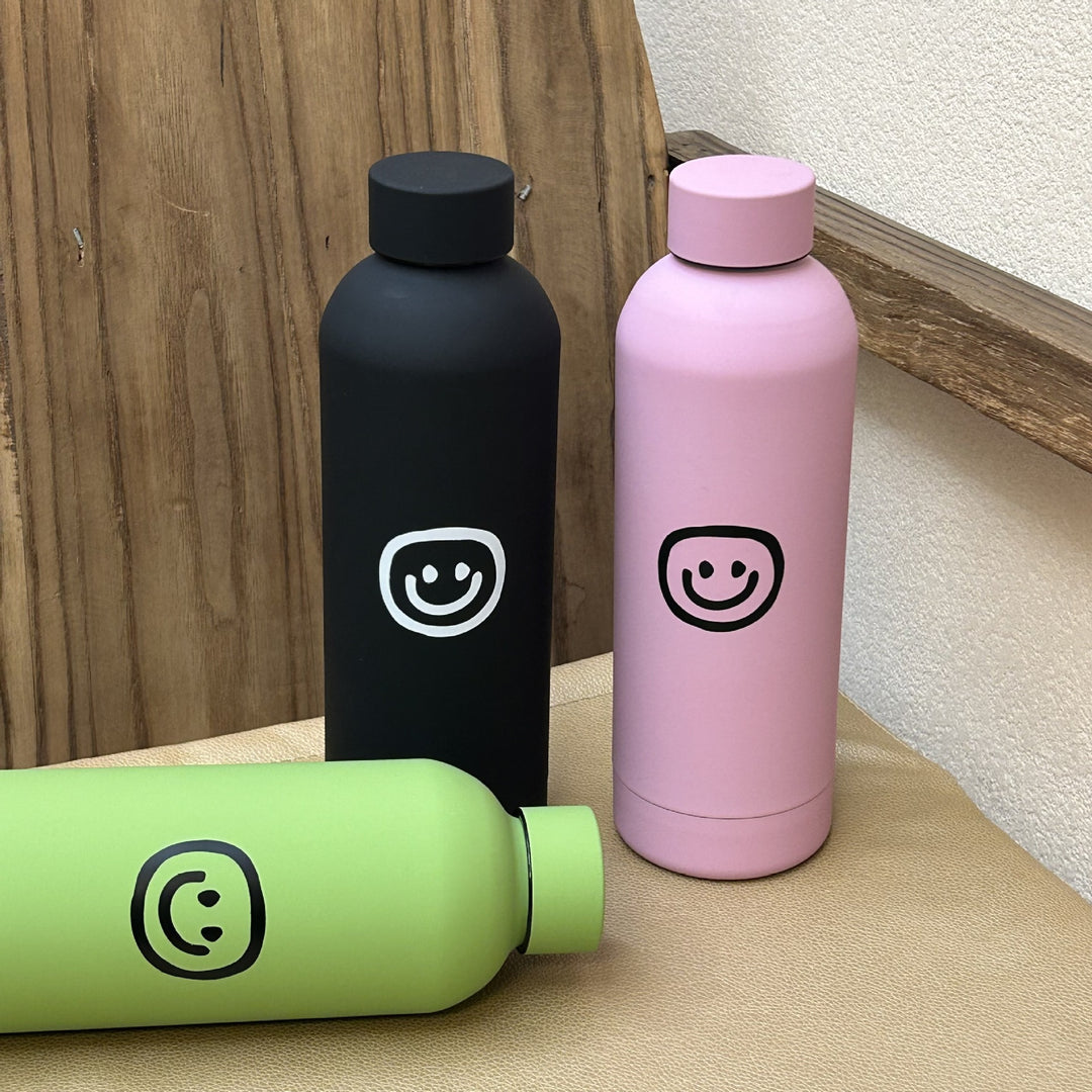 Dame isolasjonsflaske med glad smiley-design Skanto