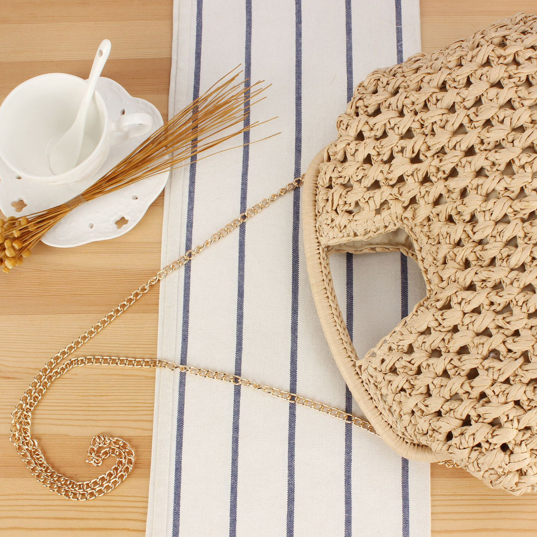 Handbag made of naturally coated braided material with elegant chain detail Skanto